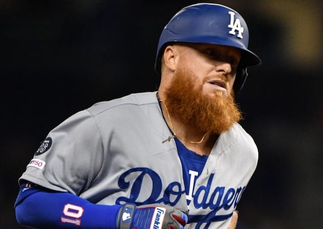 Los Angeles Dodgers third baseman Justin Turner rounds the bases after hitting a home run against the Miami Marlins