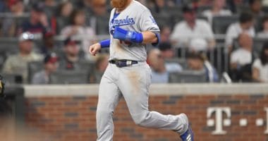 Los Angeles Dodgers third baseman Justin Turner scores a run against the Atlanta Braves