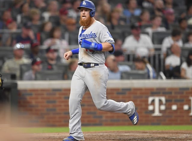 Los Angeles Dodgers third baseman Justin Turner scores a run against the Atlanta Braves
