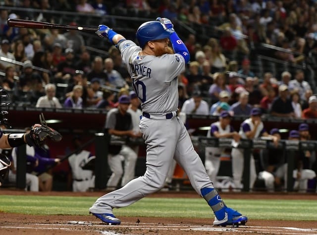 Los Angeles Dodgers third baseman Justin Turner hits a sacrifice fly