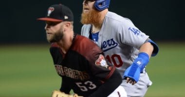 Los Angeles Dodgers third baseman Justin Turner leads off from first base