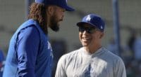 Los Angeles Dodgers manager Dave Roberts speaks with Kenley Jansen during batting practice at Dodger Stadium