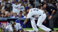 San Diego Padres third baseman Manny Machado attempts to tag out Los Angeles Dodgers catcher Will Smith