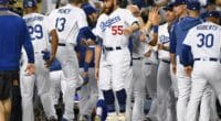 Matt Beaty, Bob Geren, George Lombard, Russell Martin, Max Muncy and Dave Roberts celebrate after a Los Angeles Dodgers walk-off win