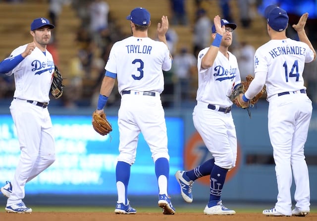 Matt Beaty, Kiké Hernandez, A.J. Pollock and Chris Taylor celebrate after a Los Angeles Dodgers win