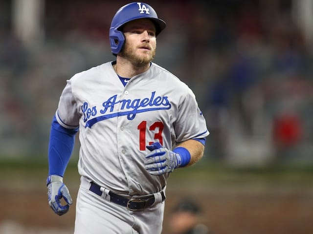 Los Angeles Dodgers infielder Max Muncy rounds the bases after hitting a home run