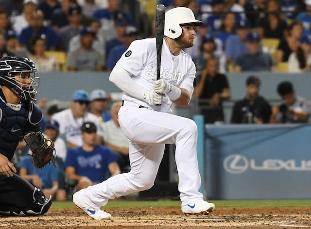 Los Angeles Dodgers infielder Max Muncy hits a single against the New York Yankees