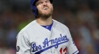 Los Angeles Dodgers infielder Max Muncy reacts after being hit by a pitch during a game against the San Diego Padres