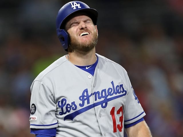 Los Angeles Dodgers infielder Max Muncy reacts after being hit by a pitch during a game against the San Diego Padres
