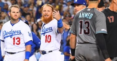 Los Angeles Dodgers bench coach Bob Geren restrains Justin Turner during a benches-clearing incident with the Arizona Diamondbacks