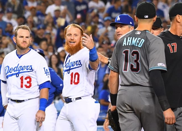 Los Angeles Dodgers bench coach Bob Geren restrains Justin Turner during a benches-clearing incident with the Arizona Diamondbacks