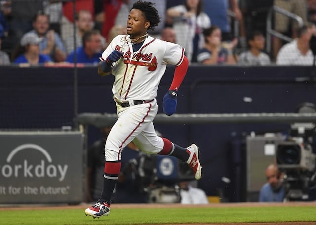 Atlanta Braves outfielder Ronald Acuña Jr. scores a run against the Los Angeles Dodgers