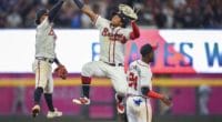 Atlanta Braves teammates Ronald Acuña Jr., Ozzie Albies and Adeiny Hechavarría celebrate after a win against the Los Angeles Dodgers