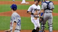Los Angeles Dodgers pitcher Walker Buehler backs up a play at home plate