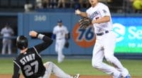 Los Angeles Dodgers shortstop Corey Seager completes a double play