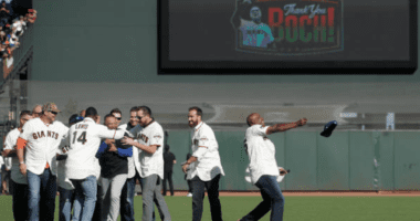 Former San Francisco Giants players greet Los Angeles Dodgers manager Dave Roberts during the Bruce Bochy ceremony