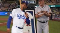 Los Angeles Dodgers manager Dave Roberts presents San Francisco Giants manager Bruce Bochy with an autographed Sandy Koufax jersey as a retirement gift