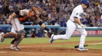 San Francisco Giants catcher Buster Posey attempts to tag Los Angeles Dodgers catcher Will Smith on a strikeout