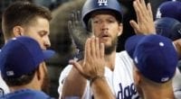 Los Angeles Dodgers pitcher Clayton Kershaw is congratulated in the dugout