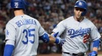 Los Angeles Dodgers teammates Cody Bellinger and David Freese celebrate after a home run