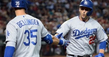 Los Angeles Dodgers teammates Cody Bellinger and David Freese celebrate after a home run