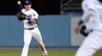 Los Angeles Dodgers infielder Gavin Lux throws the ball to Cody Bellinger