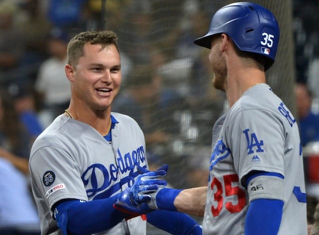 Los Angeles Dodgers teammates Cody Bellinger and Joc Pederson celebrate after a home run