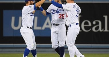 Cody Bellinger, Joc Pederson and Chris Taylor celebrate after a Los Angeles Dodgers win