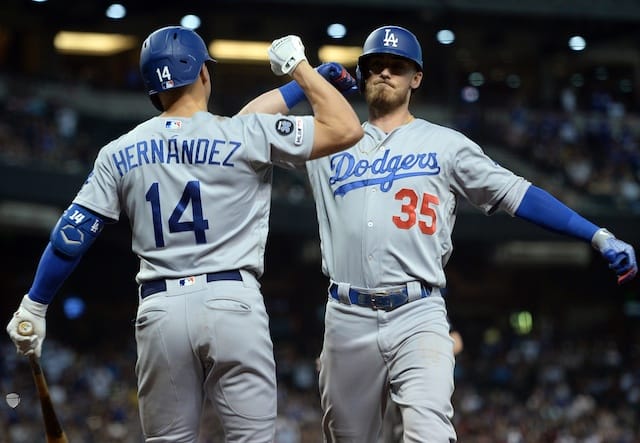 Los Angeles Dodgers teammates Cody Bellinger and Kiké Hernandez celebrate after a home run