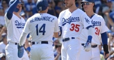 Los Angeles Dodgers teammates Cody Bellinger, Kiké Hernandez, Gavin Lux and Joc Pederson celebrate after a grand slam