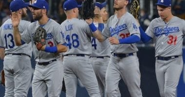 Los Angeles Dodgers teammates Cody Bellinger, Kiké Hernandez, Gavin Lux, Max Muncy, Joc Pederson and Chris Taylor celebrate after a win against the San Diego Padres