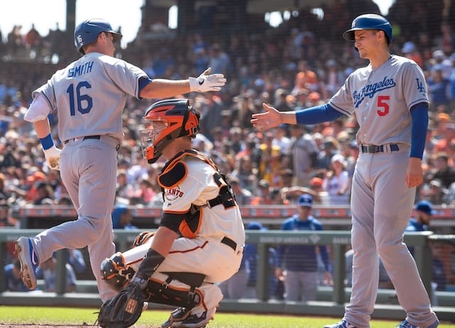 Los Angeles Dodgers teammates Corey Seager and Will Smith celebrate after a home run