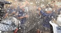 Manager Dave Roberts and the Los Angeles Dodges celebrate after clinching the NL West