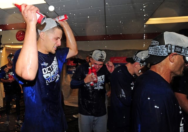 Dino Ebel, Gavin Lux, Corey Seager and the Los Angeles Dodgers celebrate after clinching the NL West during the 2019 season