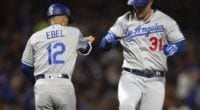 Los Angeles Dodgers third base coach Dino Ebel and Joc Pederson celebrate after a home run