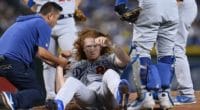 Los Angeles Dodgers trainer helps Dustin May after he was hit in the head by a line drive