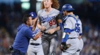 Los Angeles Dodgers pitcher Dustin May is helped to his feet after being hit by a line drive