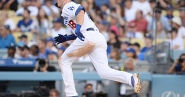 Los Angeles Dodgers infielder Gavin Lux hits a double against the Colorado Rockies