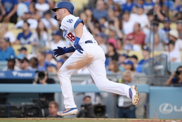 Los Angeles Dodgers infielder Gavin Lux hits a double against the Colorado Rockies