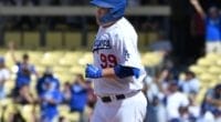 Los Angeles Dodgers starting pitcher Hyun-Jin Ryu rounds the bases after hitting his first career home run