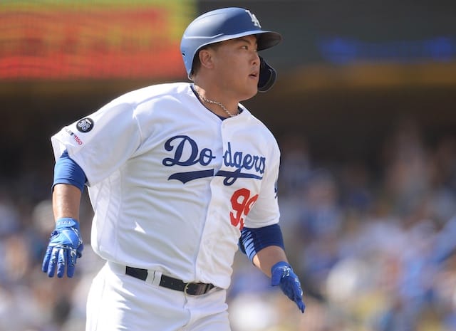 Los Angeles Dodgers starting pitcher Hyun-Jin Ryu rounds the bases after hitting a home run