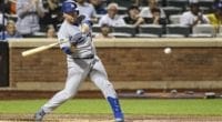 Los Angeles Dodgers infielder Jedd Gyorko hits an rBI single against the New York Mets