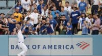 Los Angeles Dodgers outfielder Joc Pederson robs Charlie Blackmon of a home run before crashing into the wall at Dodger Stadium