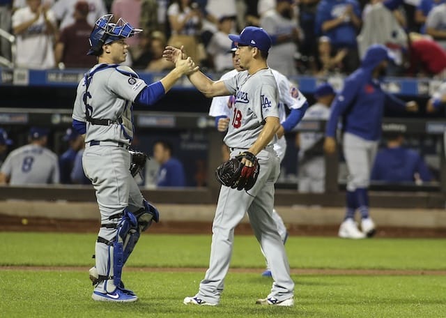 Los Angeles Dodgers pitcher Kenta Maeda celebrates with Will Smith after his save