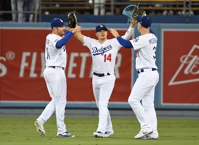 Los Angeles Dodgers teammates Kiké Hernandez, Joc Pederson and A.J. Pollock celebrate after a win