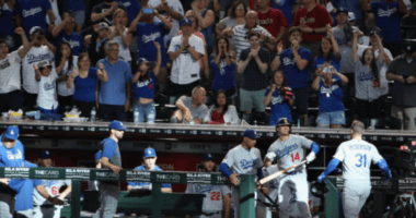 Los Angeles Dodgers manager Dave Roberts and Kiké Hernandez celebrate with Joc Pederson after a home run