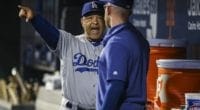 Los Angeles Dodgers manager Dave Roberts speaks with Matt Beaty in the dugout