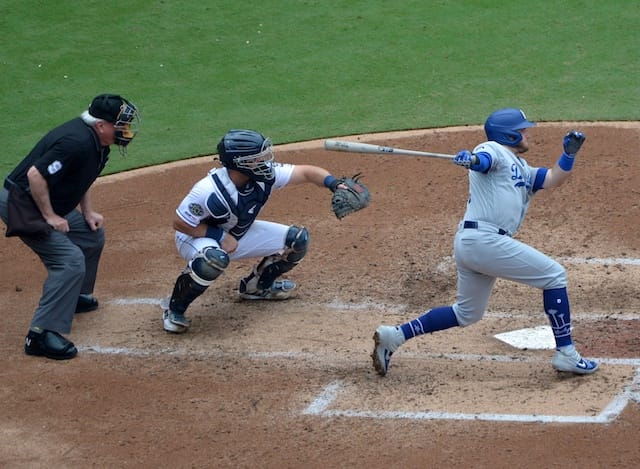Los Angeles Dodgers infielder Max Muncy hits an RBI single against the San Diego Padres