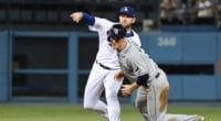 Los Angeles Dodgers infielder Max Muncy throws to first base