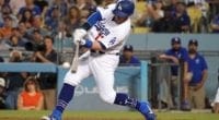 Los Angeles Dodgers infielder Max Muncy hits an RBI single against the Colorado Rockies